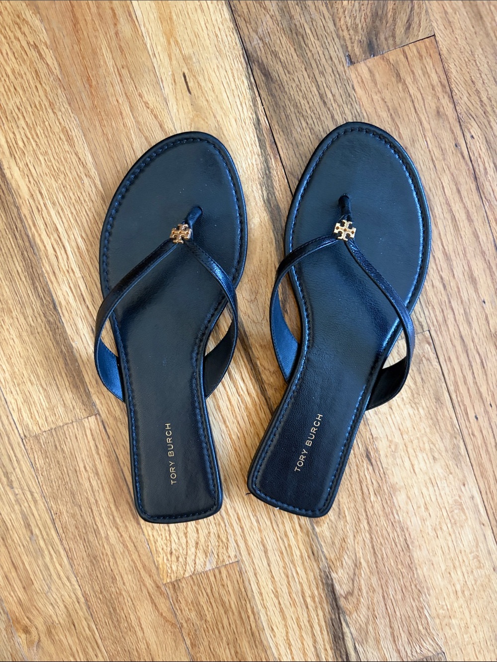 Tory Burch Black Leather Thong Sandals with Gold Logo Charm